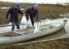 Loading the canoe with groceries