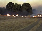 Flames close to fire truck