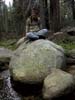 Paul on a boulder in a creek